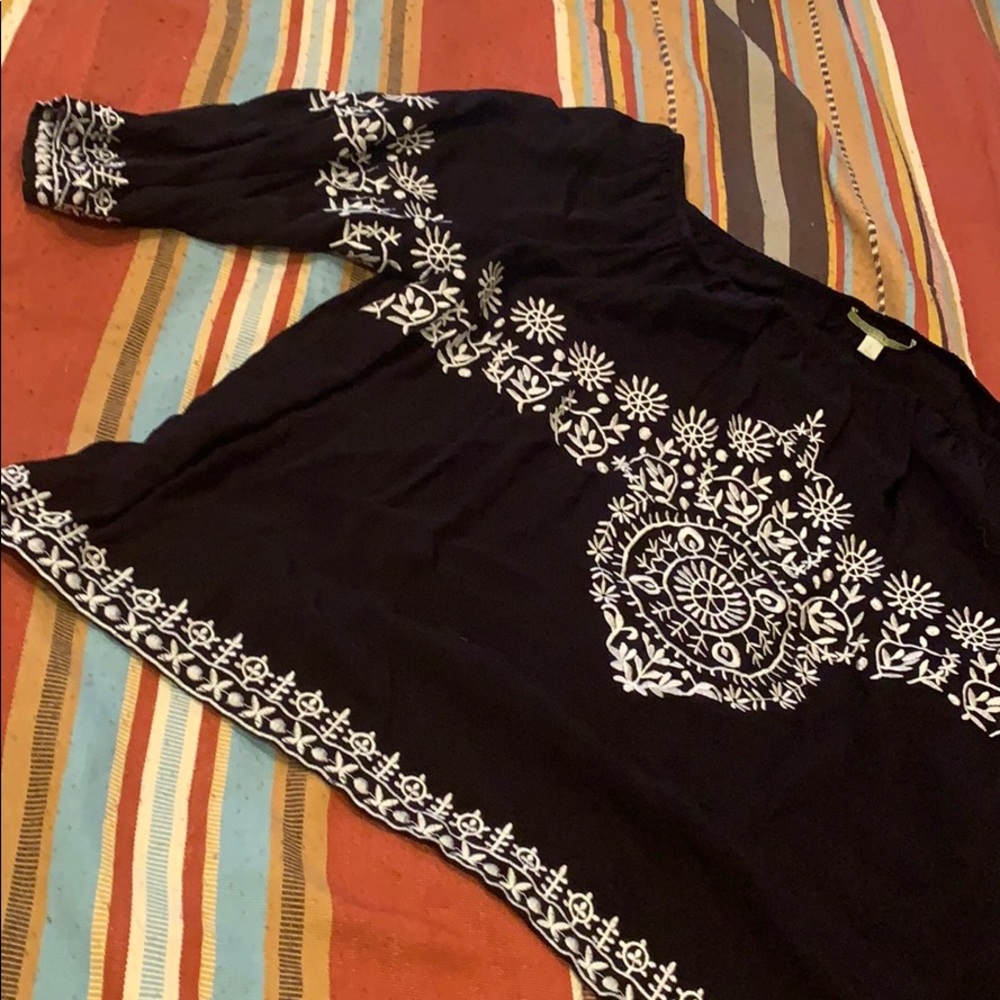 Black and white patterned blouse.